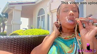 Smoker beauty jenna foxx relaxes outdoors with a cigarette.