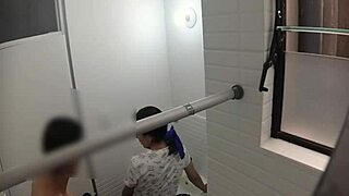 Hidden cam spies on cute teen in public bathroom.