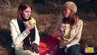 outdoor picnic with two brunette friends turns into lesbian sex using strapon.
