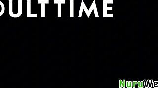 Stunning brunette masseuse pours nuru gel on huge natural tits.