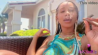 Smoker beauty jenna foxx relaxes outdoors with a cigarette.