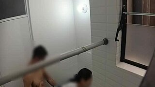 Hidden cam spies on cute teen in public bathroom.