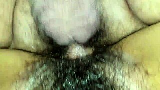 Wife's hairy pussy gets creamy during intense fucking session.