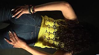 Moving butt to music in sexy outfit with long nails