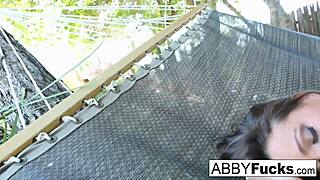 abigail masturbates while relaxing on hammock