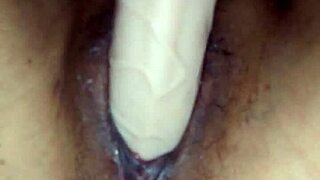 Pornstar Poosoo slides dildo deep into her tight pussy