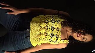 Moving butt to music in sexy outfit with long nails