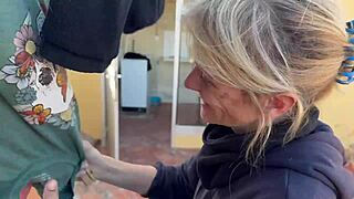 Neighbor's wife gives a homemade blowjob in the laundry room, ending with cum in her mouth.