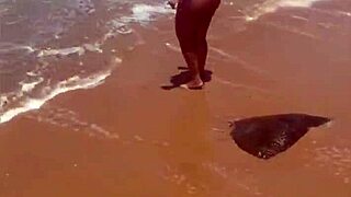 african beauty flashes boldly at the public beach today