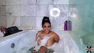 Maxine X licks her wet pussy in bubble bath, squirting