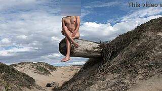 An athletic woman poses nude on the beach, teasing her cock before cumming in the plaza.