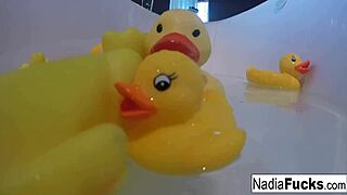 sexy nadia bathes with rubber duckies