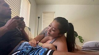 Asian babe sucks big black cock while he plays Xbox