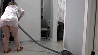 A home camera captures the mature housewife's thick ass and saggy tits under short robe