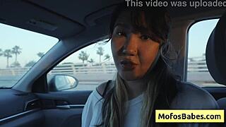 sexy asian hottie plays with natural big boobs in car