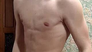 skinny boy flexes his muscles in underwear at home