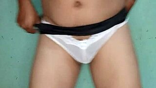Mexican guy excited in white thong lingerie.