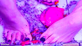 Bare toes crushing juicy fruit