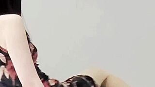 Beautiful brunette in adult one piece costume showcases her legs and small tits.