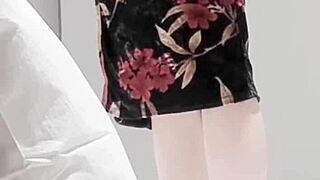 Beautiful brunette in adult one piece costume showcases her legs and small tits.