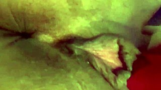 Tattooed woman teases her wet puffy pussy with toys.