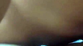 Latina brunette starts recording herself alone at home.