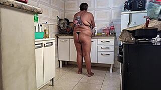 Stepmom takes huge cumshot on face in kitchen.