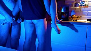 Wife sucks two cocks in threesome under neon lights.