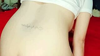 Petite girl inserts large dildo deeply into her vagina for orgasm