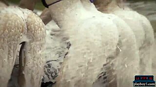 Playboy babes in hot bikinis wash a mercedes amg gt outdoors.