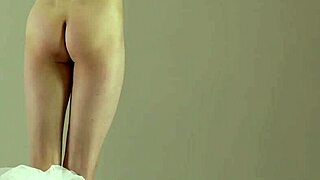 Blonde gymnast shows off acrobatic moves in the gym