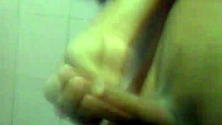 This young guy is casually jerking off in a solo masturbation session.