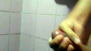 This young guy is casually jerking off in a solo masturbation session.