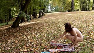 a well-shaped teen poses in nature.