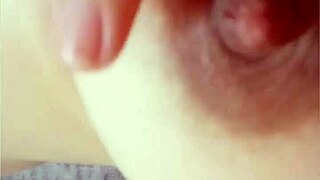 Gretala pinches her natural tits.