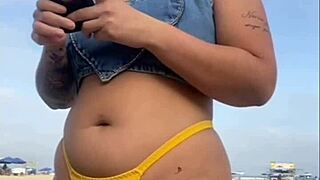 African woman flashes on beach