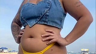 African woman flashes on beach