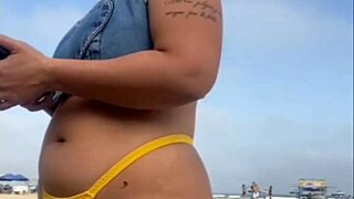 African woman flashes on beach