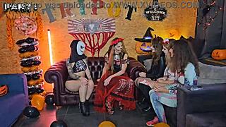 Five girls in costumes lick pussies and strap-on fuck asses at Halloween party with Alice Maze and Irogenia.