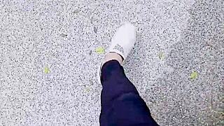 Chinese crossdressing ladyboy masturbates outdoors in stockings during midday urge.