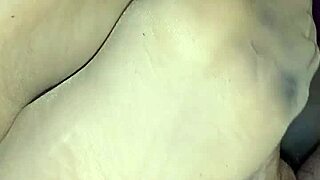 She gives a homemade footjob while wearing sheer nylons