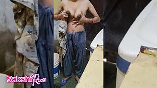 Sexy Sakshi gets naked in bathroom shower with big natural tits and tight pussy while changing clothes as Indian milf.