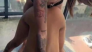 kashofficials bends over on the balcony getting strapped doggystyle by renity love with ebony lesbian strapon action and tight pussy riding in public