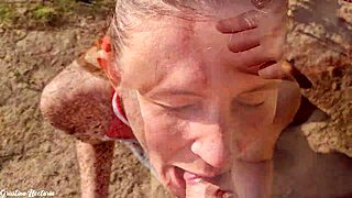 Skinny brunette with ponytail gives blowjob in forest and tastes cum