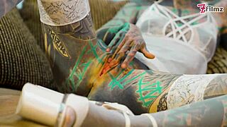 hey, check out this tattooed girl going solo with a big dildo in sexy fishnets, high heels, and stockings... her petite frame and piercings make it wild