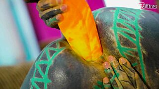 hey, check out this tattooed girl going solo with a big dildo in sexy fishnets, high heels, and stockings... her petite frame and piercings make it wild