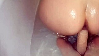 Juicy ass girl dildo plays and fingers in shower to squirt