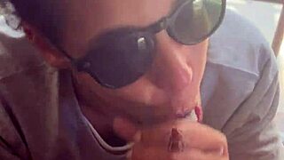 In a homemade setup, lightskin ebony slut gives blowjob to big black cock friend by the window and takes facial cumshot.