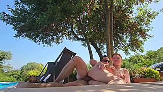 Amateur redhead with big natural tits gives blowjob and rides cowgirl in outdoor pool creampie couple sex.