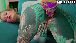 this skinny goth girl with tattoos and piercings fingers her asshole in solo masturbation. she uses dildo for gaping anal play.
